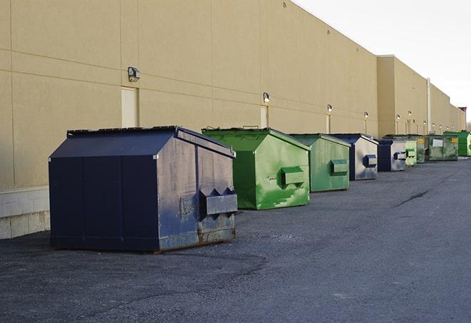 construction waste bins waiting to be picked up by a waste management company in Austin